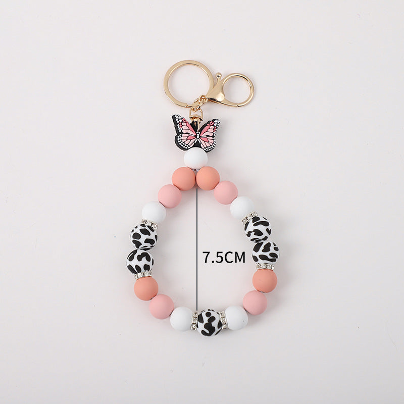 Wholesale Rubber Tassel Silicone Wood Water Keychain